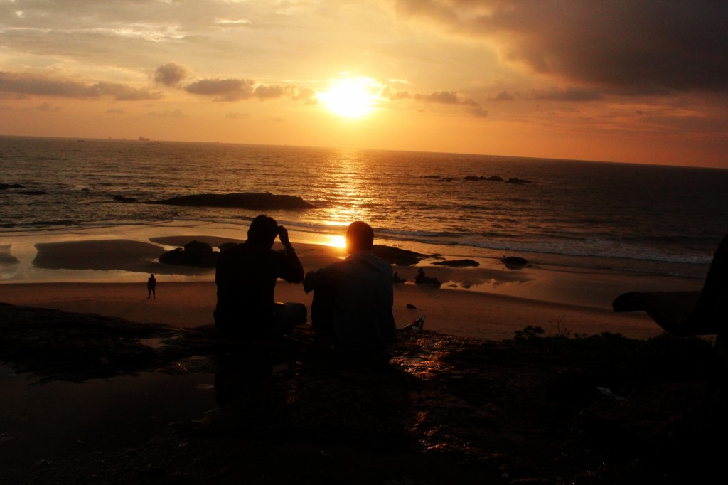 two-friends-having-a-chat-at-sunset-at-a-beach-f4